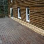 Log slabs are then placed over the exposed areas and then finished off with matching stain.